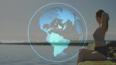 Antrenörde kaybolan hologramdan sonra saç bağlama, antrenman hazırlama, dünyayı döndürme, yakıt ikmali. Fitness, sağlık, yoga, meditasyon, açık hava, sükunet, farkındalık