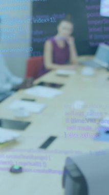 Animation of financial data processing over diverse business people in office. Global business, finances, computing and data processing concept digitally generated video.