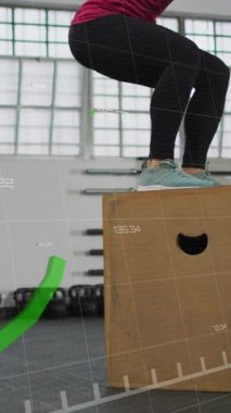 Spor salonunda atlama hareketleri yapan bir kadının spor salonunda spor yaptığını gösteren veriler. egzersiz, teknoloji, eğitim, sağlık, egzersiz