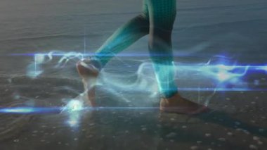 Dişi sörfün içine giriyor ve buzağıları saran hologram veri ile fitness takip cihazını çalıştırıyor. Fütürist, dijital, holografik, atletik, açık hava, enerjik, teknoloji