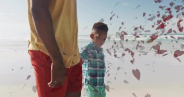 Baba ve oğul el ele tutuşarak, pazarlama için kalp şeklindeki yaprakların kıvrılmasına neden oluyor. Aile, bağ, bağ, dinginlik, sevgi, sükunet, doğa