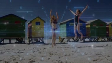 Kardeş kızlar kulübelerle sahile adım atıyorlar. İp atlama ritmini spor için animasyonla koordine ediyorlar. Çocuklar, arkadaşlık, eğlence, canlı, açık hava, neşeli, enerjik