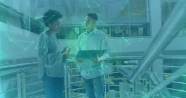 Professionals analyzing network overlays in office atrium walkway, with laptop and globe projection. Collaboration, innovation, technology, futuristic, urban, corporate, communication