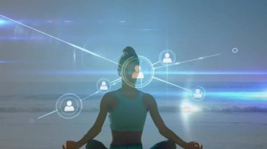 Sahilde oturmuş meditasyon yapan bir kadın, teknolojik bağlantıyı gösteren düğümler ve çizgiler üretiyor. Farkındalık, bağlantı, dinginlik, dijital, sakin, rahatlama, refah