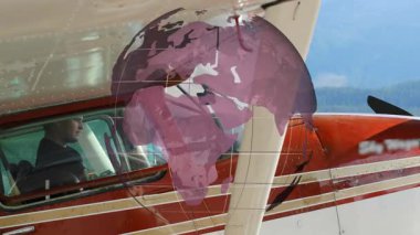 Dönen şeffaf dünya, kokpit pilotunun havacılık kalkışı için göstergeleri taradığını gösteriyor. Macera, keşif, havacılık, teknoloji, yenilik, navigasyon, seyahat