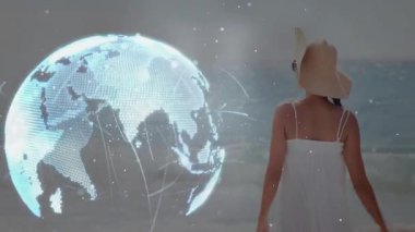 Şapka kenarını kavrayan kadın holografik küreyi döndürüyor ve genişletiyor. Teknoloji kavramını gösteriyor. Fütürist, dijital, ağ, yenilik, okyanus görüşü, minimalizm, bağlantı