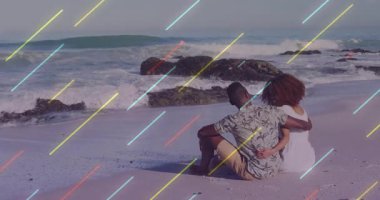 Seyahat reklamı, renkli kaplamanın etrafını saran kumlu kollara yerleşen bir çifti gösteriyor. Romantizm, samimiyet, sükunet, doğa, rahatlık, günbatımı, bağlantı