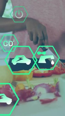 Mutfaktaki sebzeleri çevre dostu ikonlarla doğramak. Yemek pişirme, sürdürülebilirlik, sağlıklı, hazır, yeşil, taze