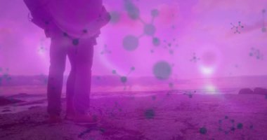 İkinci figür, sahil örtüsü örtüsü ve moleküler sağlık örtüsü altında bir çifte yaklaşıyor. Romantik, bağlantı, dinginlik, koruma, birlik, bilimden esinlenilmiş, ortam