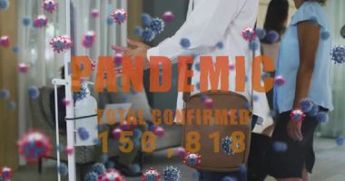 Kadın dezenfektan kullanıyor ve artan salgın sayısı ile yüzen virüs ikonlarını etkinleştiriyor. Sağlık, hijyen, koruma, güvenlik, temizlik, sağlık, kamu sağlığı