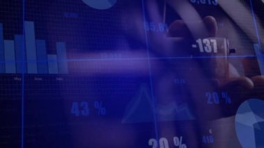 Man's hands tapping tablet screen in office, cycling business charts showing bar, pie and line data. Data, analytics, visualization, digital, finance, dashboard, growth