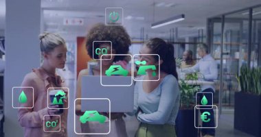 Three women opening laptop and viewing floating green icons showing metrics for business analysis. Collaboration, innovation, sustainability, technology, teamwork, modern, professional