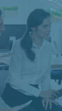 Animation of financial data processing over diverse business people using computer in office. Global business, finance, computing and data processing concept digitally generated video.