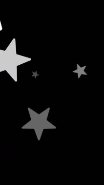 Siyah arka plana düşen beyaz noel yıldızlarının animasyonu. Noel, gelenek ve kutlama konsepti dijital olarak oluşturuldu.