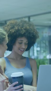 Animation of financial data processing over diverse business people working in office. Global business, finances, computing and data processing concept digitally generated video.