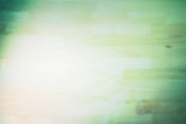 Soyut ışık sızıntısı düz tasarım pastel yeşil ahşap dokuya yayılıyor. Minimalist, dingin, yumuşak, dokulu, organik, modern, sakinleştirici.