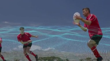 Kırmızı oyuncu yandan geçiyor, rakip takla atıyor, analitik kuvvet göstergesi gösteriyor. Takım, atletik, açık hava, spor, yarışma, aksiyon, yeşil