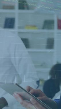 Animation of financial data processing over diverse business people working at office. Global business, finances and digital interface concept, digitally generated video.