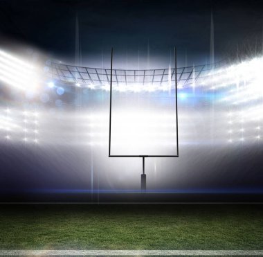 Empty football turf glowing under floodlights in stadium, goalpost rising with yard line marker. Sports, outdoor, dusk, illumination, athletics, competition, field