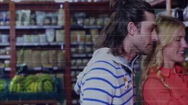 Çift koridorda kavanoz teftiş ve okuma etiketi, ortaya çıkan grafik örtüsü beslenme eğilimini gösteriyor. Bakkal, sağlık, analiz, tazelik, organik, pazarlama, yaşam tarzı