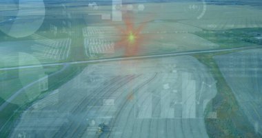 Harvesting wheeled harvester cutting crop rows over farm landscape, with digital overlays. Agriculture, technology, data visualization, innovation, sustainability, spatial analysis, aerial view