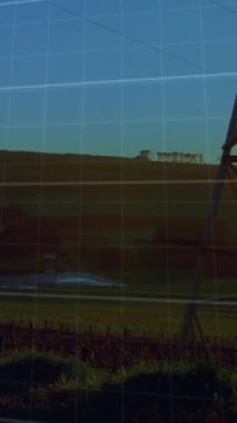 Animation of financial data processing over electricity pylon. Global ecology, finances and digital interface concept digitally generated video.