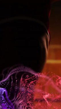 Afro-Amerikan erkek basketbolcu üzerinden kırmızı parçacıkların animasyonu. spor ve yarışma konsepti, dijital olarak oluşturulmuş video.