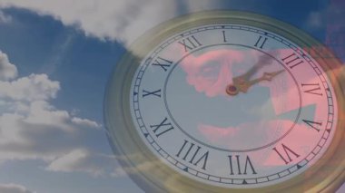 Başlangıçta analog saat elleri ilerlerken kırmızı yüzün altındaki bulutlar zamanın geçtiğini gösteriyor. Zamanlama, geçicilik, sürrealizm, sembolizm, hava, hareket, kavramsal