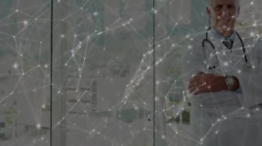 Sürüklenen şebeke doktor kollarının katlanmış olduğunu gösteriyor. Titreşen düğümler tıbbi teknolojiyi vurguluyor. Gelecekçi, yenilikçi, sağlık, bağlantı, dijital, profesyonel, kentsel