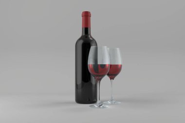 Gri arka planda yarısı dolu şarap kadehleri olan şişe.