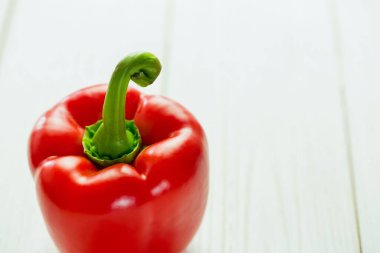 Close-up of fresh red pepper on wooden table