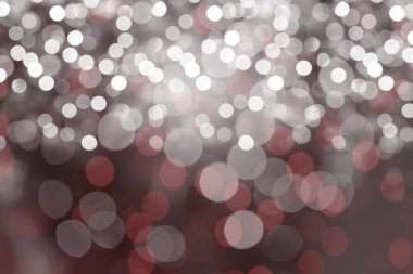 Düz dizayn bokeh ışık deseni bulanık zemin üzerinde yumuşak beyaz ve sessiz kırmızı daireler yayıyor. Soyut, rüya gibi, aydınlık, minimalist, atmosferik, ruhani, zarif