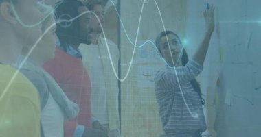 Business team presenter grabbing marker annotating notes to analyze while data waveforms appearing. Collaboration, brainstorming, innovation, strategy, teamwork, communication, planning