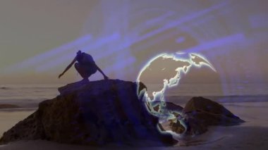 Gün batımında kıyıdaki kayaya yaklaşan bir kadın meditasyonda oturuyor. Küre ve süpürme izleriyle. Deniz kenarı, sükunet, farkındalık, rahatlama, navigasyon, tefekkür, görsel efektler.