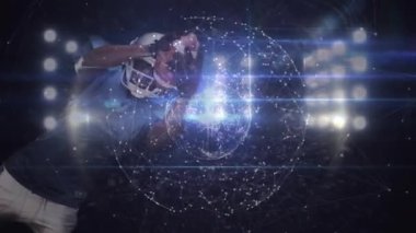 Dijital küre titreşimi futbolcunun ortaya çıkmasına neden oluyor, sonra da projektörlerin altında topu fırlatıyor. Spor, dijital, teknoloji, atlet, stadyum, aksiyon, yarışma