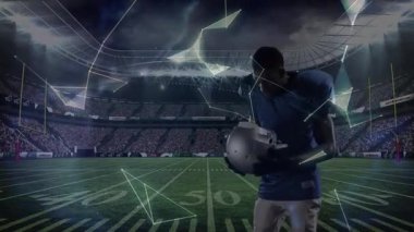 Futbol oyuncusu, stadyumda kask kaldırıyor ve takım arkadaşı ortaya çıkarken dijital küre oluşturuyor. Sporcu, spor, rekabet, dijital, gelecekçi, takım çalışması, güç