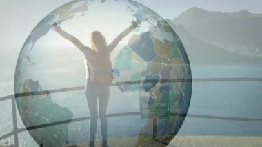 Deniz uçurumunda kollarını kaldıran bir kadın teknolojik veri bağlantısını gösteren dünya animasyonunu başlatıyor. Macera, keşif, bağlantı, yenilik, açık hava, manzara, güçlendirme