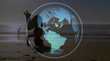 Mavi küre gün batımı plajında kayboluyor ve dönüyor. Elinde yoga amuda kalkmış yürüyen bir kadın var. Küre, sağlık, dinginlik, zindelik, tefekkür, sükunet, farkındalık.