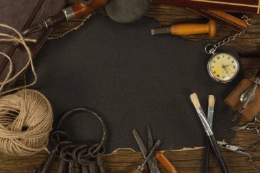 Paper piece with tools on table, Close-up