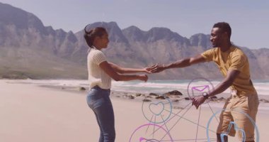 Romantik dönüşler sırasında plajda el ele tutuşan erkek ve kadın sosyal medya simgelerini etkinleştiriyor. Romantizm, bağlantı, neşe, doğa, teknoloji, uyum, samimiyet