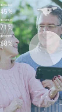 Animation of financial data processing over senior caucasian couple using smartphone. Global business, finances and digital interface concept digitally generated video.