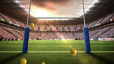 Tek altın balon kale direklerinin altından çıkıyor güneş doğarken yükselen ve dağılan kümeler oluşturuyor. Kutlama, zafer, iyimserlik, dinginlik, açık hava, canlı, görkemli