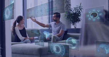 Gesturing tech professionals interacting with holographic dashboards in office lounge, with tablet. Technology, collaboration, innovation, modern, business, data, digital