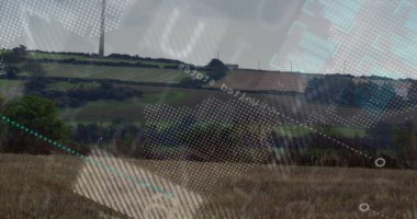 Turbine rising over meadow, hedgerow shrubs in farmland, with digital overlay patterns, copy space. Renewable, landscape, eco-friendly, agricultural, futurism, environment, technological