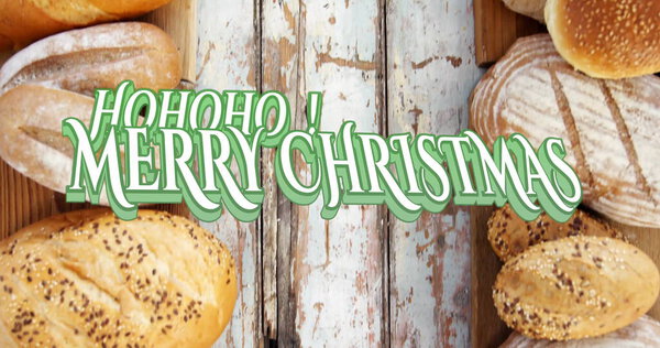 Stylized holiday text spreading cheer on wooden counter, with seeded baguette and assorted breads. Rustic, artisanal, bakery, festive, textured, handcrafted, celebration