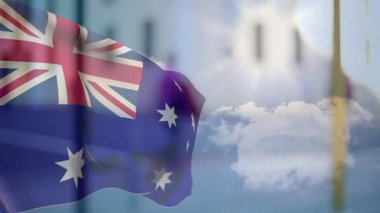 Gündoğumu hafif bir esinti yaratıyor. Avustralya bayrağının mavi gökyüzünde yavaşça dalgalanmasına neden oluyor. Yurtsever, açık hava, hareket, milli amblem, manzara, sembolizm, huzur