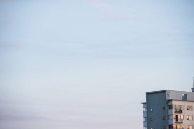 Cropped image of building against blue sky