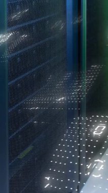 Animation of binary coding data processing against computer server room. Computer interface and business data storage technology concept