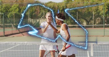 Shaking hands two women tennis players showing respect on hard court, with rackets, net and fence. Athletes, sportsmanship, competition, outdoors, recreation, determination, elegance