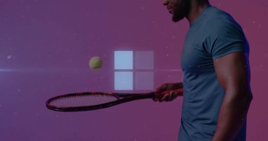 Balancing tennis ball on racket, man wearing tee in studio, with four-square logo copy space. Dynamic, sport, futuristic, technology, energetic, modern, performance